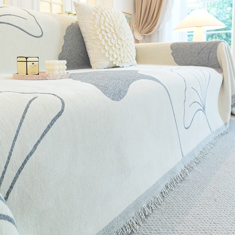 Couverture de canapé à franges motif damier – Élégance, confort et design intemporel pour votre intérieur – par Camado